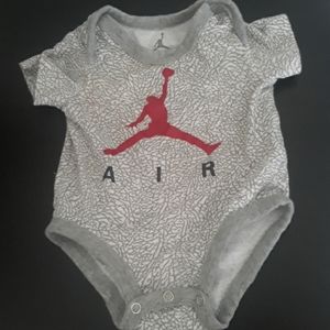 Perfect condition AirJordan onesie.